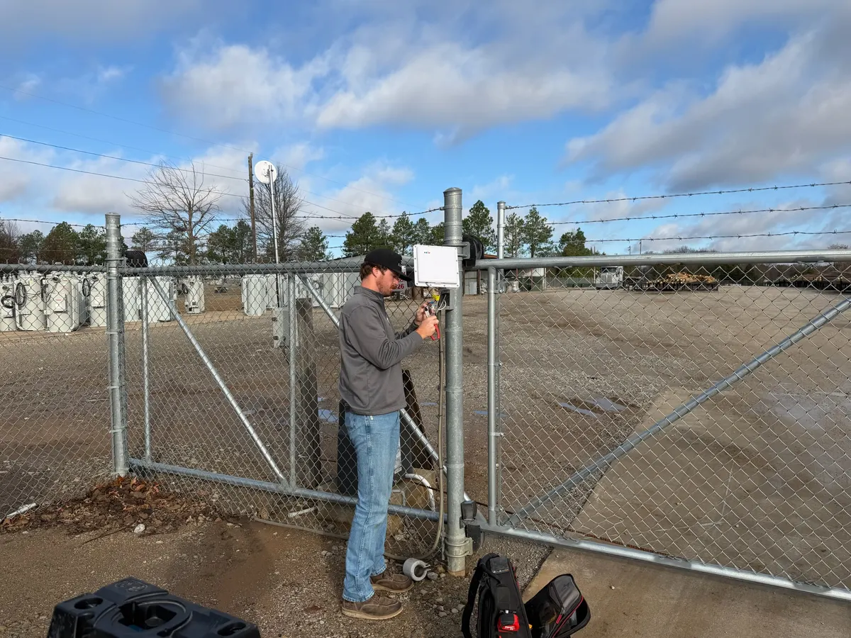 Tulsa Lock & Key technician wiring a gate keypad